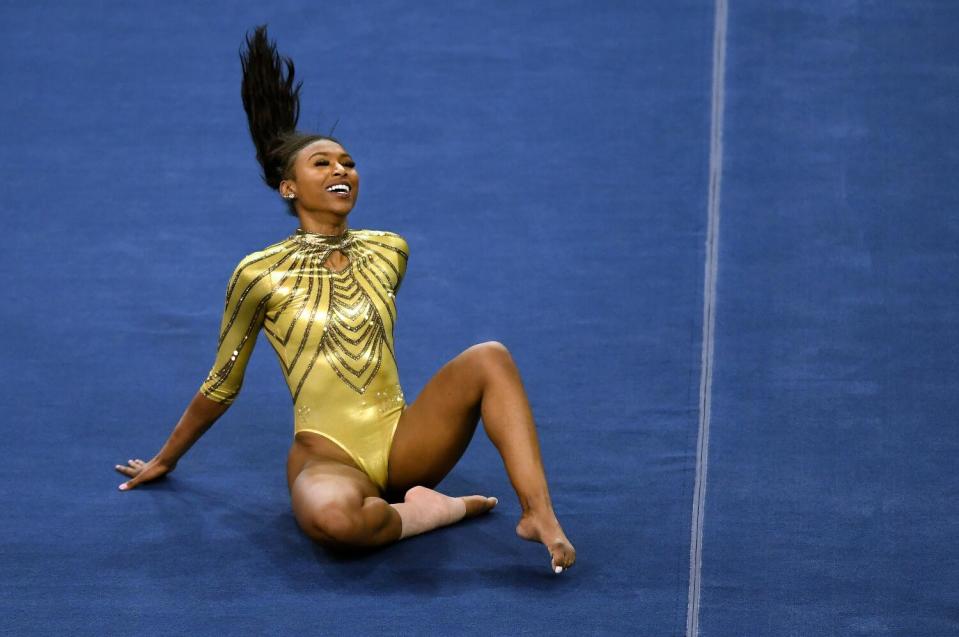 UCLA's Nia Dennis competes on the floor.
