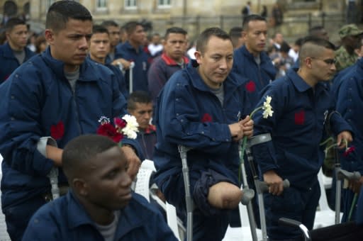 Colombian soldiers maimed by landmines attend a ceremony in Bogota for the UN International Day for Mine Awareness and Assistance in 2011