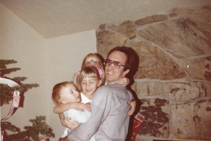 Jordan Rasmussen is pictured with his children at Christmas 1981. | Family photo