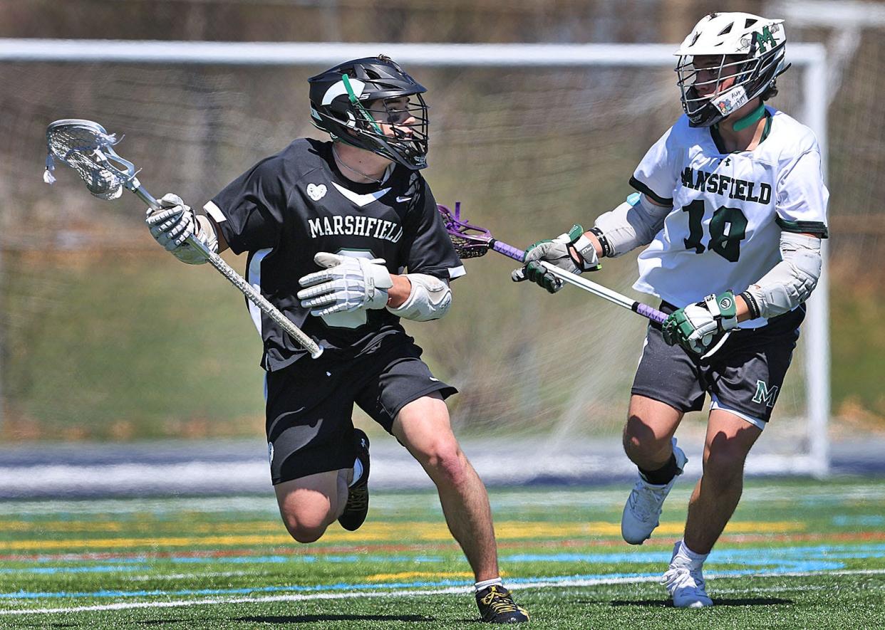 Marshfield captain Nic Cupples comes rom behind the Mansfield net looking for an open attacker

The Chowda Cup, a boys lacrosse tournament hosted by Cohasset in action on Tuesday April 16, 2024