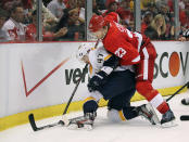 DETROIT, MI - APRIL 15: Alexander Radulov #47 of the Nashville Predators tries to control the puck in front of Brad Stuart #23 of the Detroit Red Wings during Game Three of the Western Conference Quarterfinals during the 2012 NHL Stanley Cup Playoffs at Joe Louis Arena on April 15, 2012 in Detroit, Michigan. (Photo by Gregory Shamus/Getty Images)