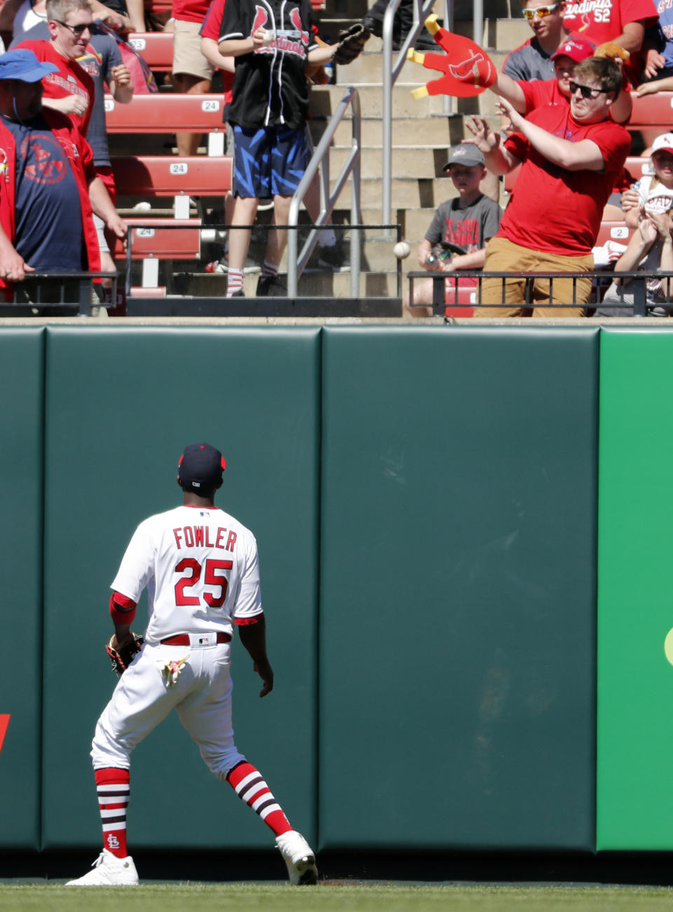 St. Louis Cardinals center fielder Dexter Fowler watches his solo home run by New York Mets' Robinson Cano during the fifth inning of a baseball game Sunday, April 21, 2019, in St. Louis. (AP Photo/Jeff Roberson)