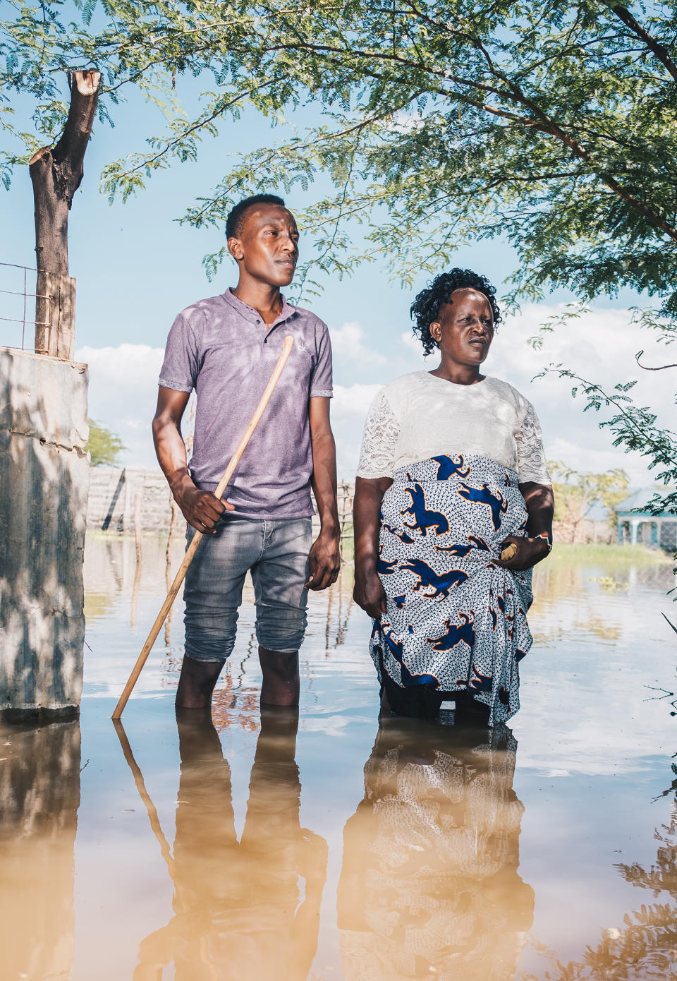 Festus and Veronica Parkolwa stand at the entrance of their former home by Lake Baringo in November.<span class="copyright">Khadija M. Farah for TIME</span>