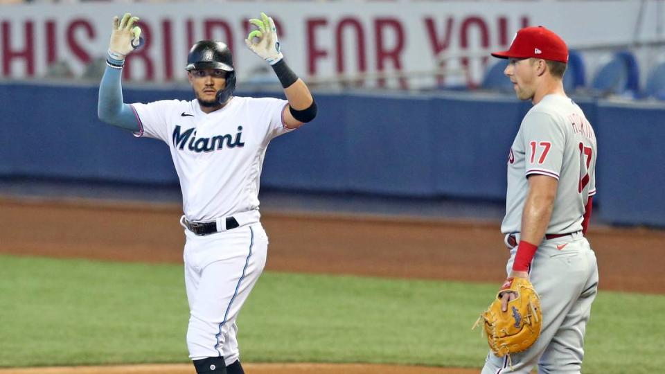 Miami Marlins shortstop Miguel Rojas (19) signals towards the dugout after hitting a single in the seventh innning as the Miami Marlins play the Philadelphia Phillies during a baseball game on at loanDepot park on Thursday, May 27, 2021.