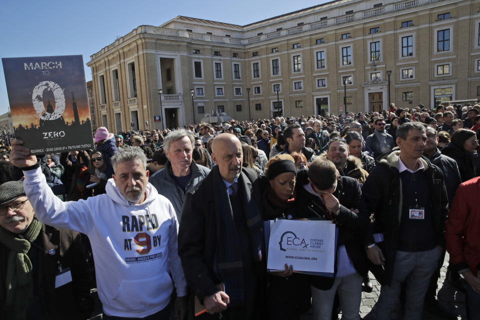 Front row from left, sex abuse survivors and members of ECA (Ending Clergy Abuse), Piero Broggi, Peter Isley, Denise Buchanan, Alessandro Battaglia, listen to Pope Francis speech just outside St. Peter's Square at the Vatican during the Angelus noon prayer, Sunday, Feb. 24, 2019. (AP Photo/Alessandra Tarantino)