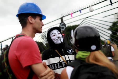 Demonstrators gather in front of an Air Force base during a rally against Venezuelan President Nicolas Maduro's government in Caracas, Venezuela, June 24, 2017. REUTERS/Marco Bello