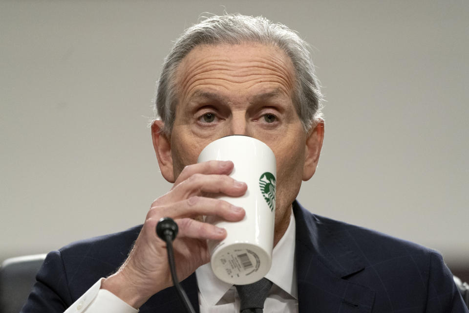 Former Starbucks CEO Howard Schultz drinks from a Starbucks mug as he testifies before the Senate Health, Education, Labor and Pensions committee, Wednesday, March 29, 2023, on Capitol Hill in Washington. (AP Photo/Jacquelyn Martin)