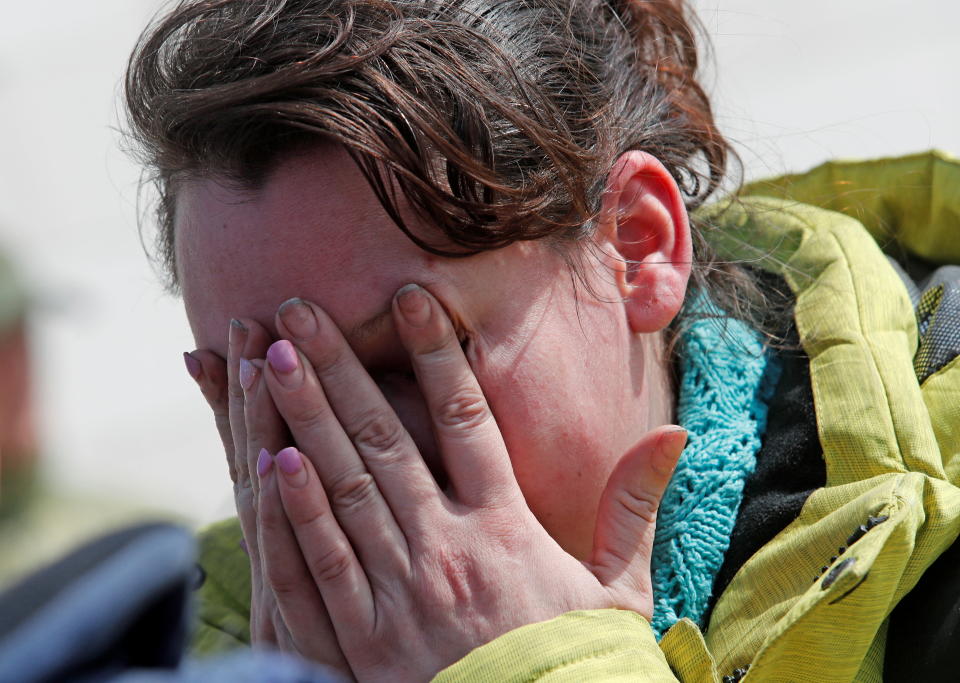 Azovstal steel plant employee Natalia Usmanova, 37, who was evacuated from Mariupol, reacts upon arrival at a temporary accommodation centre during Ukraine-Russia conflict in the village of Bezimenne in the Donetsk Region, Ukraine May 1, 2022. REUTERS/Alexander Ermochenko  REFILE - ADDING ID