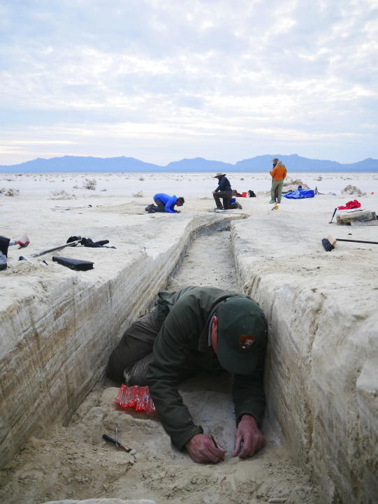 This Oct. 2023 photo made available by the National Park Service shows White Sands National Park Resource Program Manager, David Bustos at the White Sands National Park in New Mexico. Fossil human footprints discovered in White Sands, New Mexico likely date back to between 21,000 and 23,000 years ago, according to two lines of scientific evidence published Thursday, Oct. 5, 2023. (NPS via AP)