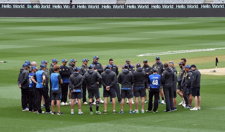 New Zealand cricketers gather in a huddle during a training session at the Melbourne Cricket Ground on March 27, 2015 ahead the Cricket World Cup final match between Australia and New Zealand