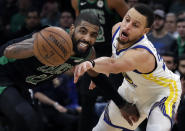 Golden State Warriors guard Stephen Curry, right, attempts to steal the ball from Boston Celtics guard Kyrie Irving (11) in the fourth quarter of an NBA basketball game, Saturday, Jan. 26, 2019, in Boston.