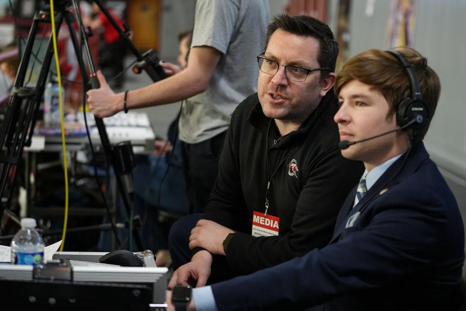 General manager of UINDY TV Rick Dunkle (left) and executive producer for news and sports Nathaniel Finch monitor screens during a day-long broadcast of back-to-back NCAA Division II midwest regional basketball games Saturday, March 11, 2023, at Nicoson Hall at the University of Indianapolis. 