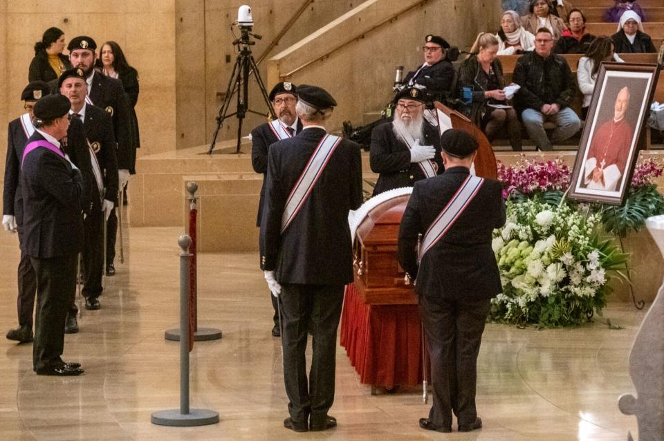 The casket is closed before the vigil Mass