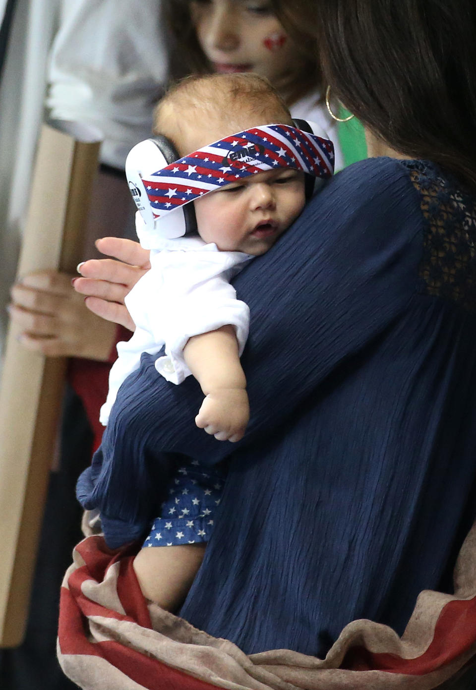 RIO DE JANEIRO, BRAZIL - AUGUST 11: Michael Phelps' fiancee Nicole Johnson, holds their son Boomer Phelps on day 6 of the Rio 2016 Olympic Games at Olympic Aquatics Stadium on August 11, 2016 in Rio de Janeiro, Brazil. (Photo by Jean Catuffe/Getty Images)