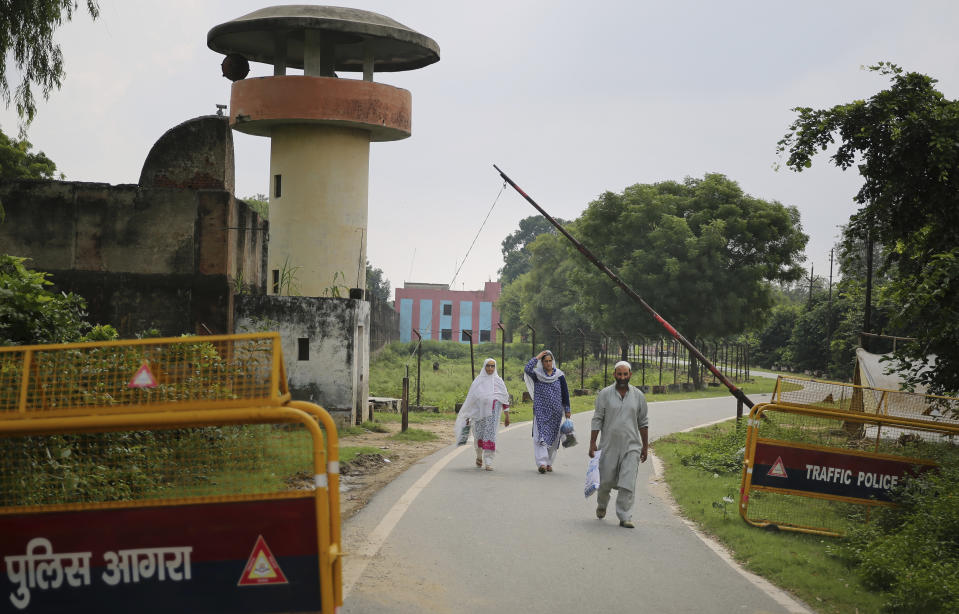 Kashmiris leave the Agra Central Jail premise after meeting a relative lodged in the jail, in Agra, India, Friday, Sept. 20, 2019. Families from the Himalayan region of Kashmir have traveled nearly 1,000 kilometers (600 miles) in sweltering heat to meet relatives being held in an Indian jail in the city of Agra. At least 4,000 people, mostly young men, have been arrested in Indian-held Kashmir since the government of Prime Minister Narendra Modi imposed a security clampdown and scrapped the region’s semi-autonomy on Aug. 5, according to police officials and records reviewed by AP. (AP Photo/Altaf Qadri)