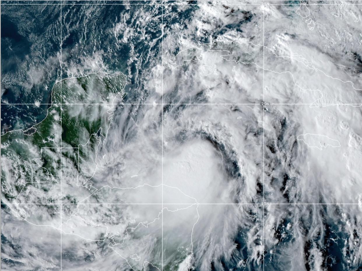 This satellite image provided by the National Oceanic and Atmospheric Administration shows Tropical Storm Zeta,, on Sunday 25 October at 2110 GMT (5:10 p.m. ET) ((Associated Press))