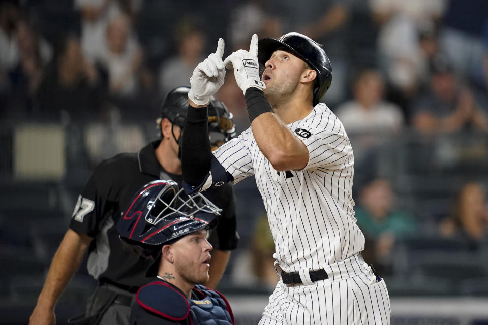 New York Yankees' Joey Gallo gestures as he crosses home plate after hitting a solo home run off Cleveland Indians starting pitcher Zach Plesac during the second inning of a baseball game Friday, Sept. 17, 2021, in New York. (AP Photo/John Minchillo)