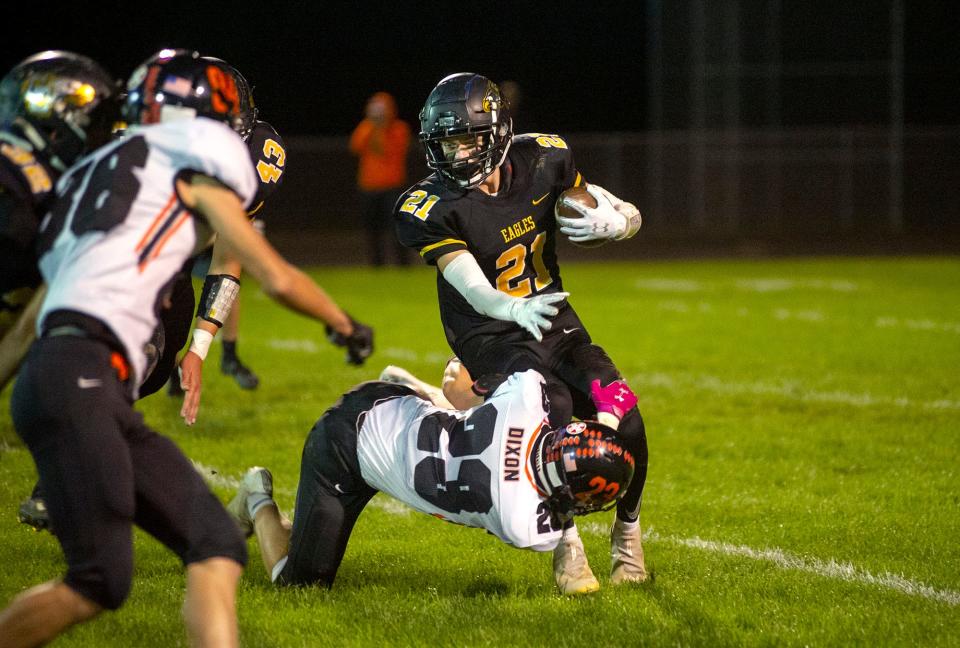 Colonel Crawford's Trevor Vogt is tackled by Seneca East's Laine Dixon.