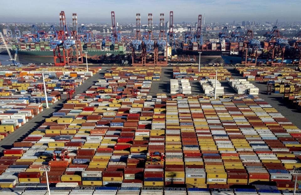 FILE - Shipping containers are stacked at the harbor in Hamburg, Germany, Oct. 26, 2022. A confidential document obtained by The Associated Press shows the International Chamber of Shipping advised its national branches in March that member companies should "give careful consideration to the possible implications" before committing to a new plan to reduce maritime emissions. (AP Photo/Michael Probst, File)