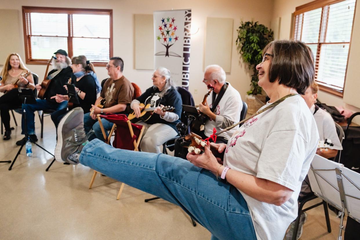 Paula Hostetler, from Strasburg, leads the T-County Ukulele Squad during a special performance, at the Tuscarawas County Senior Center in Dover.