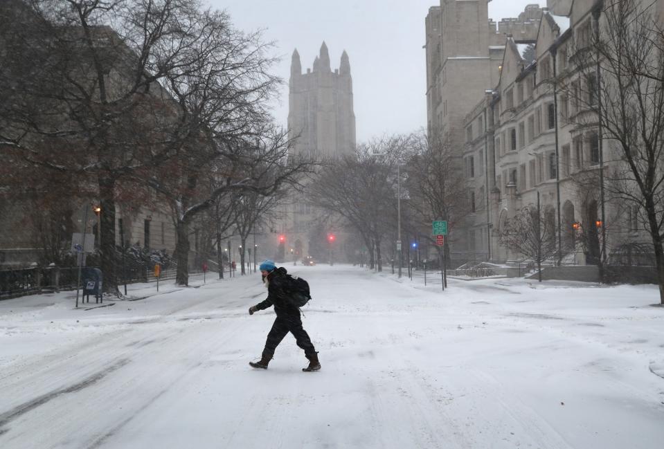 A woman walks through the campus of Yale University in New Haven, Connecticut.