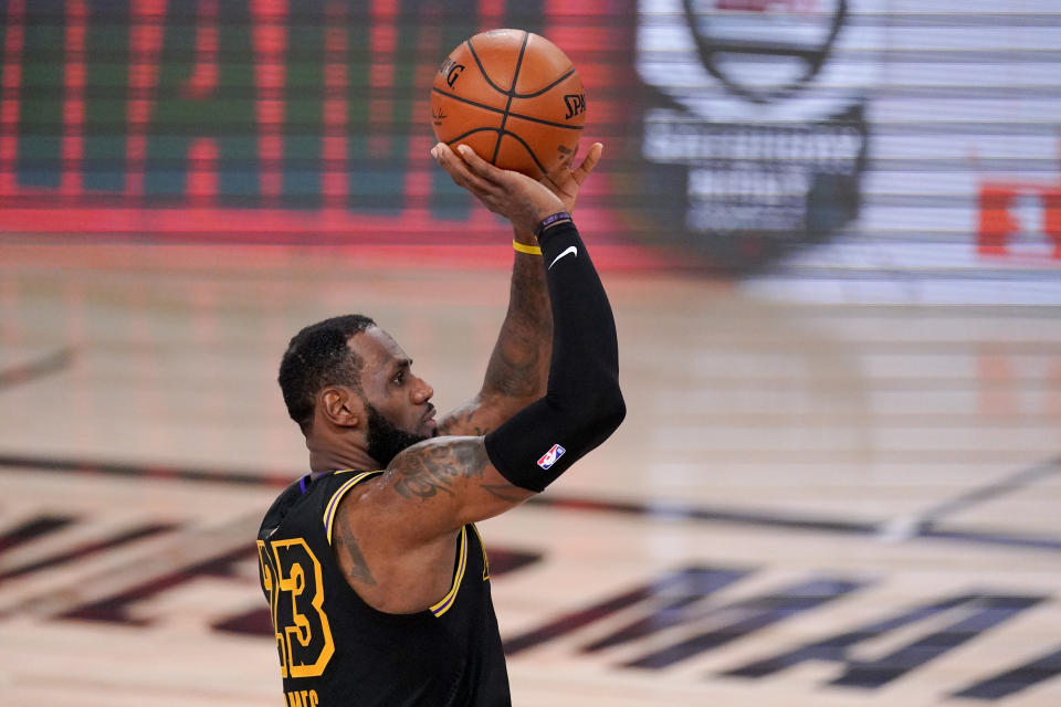 Los Angeles Lakers forward LeBron James shoots against the Miami Heat during the second half in Game 5 of basketball's NBA Finals Friday, Oct. 9, 2020, in Lake Buena Vista, Fla. (AP Photo/Mark J. Terrill)