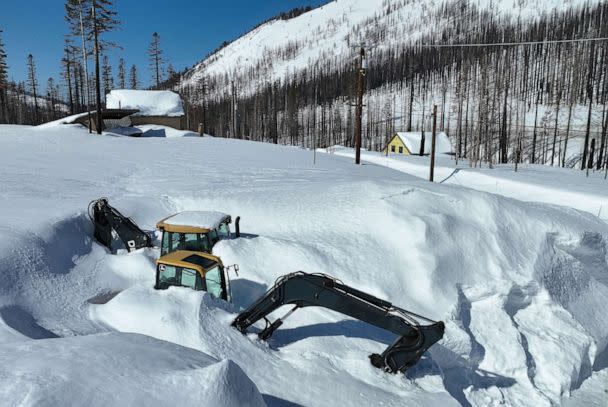 PHOTO: In an aerial view, a backhoe is seen covered in snow, March 3, 2023, in Twin Bridges, Calif. (Justin Sullivan/Getty Images)