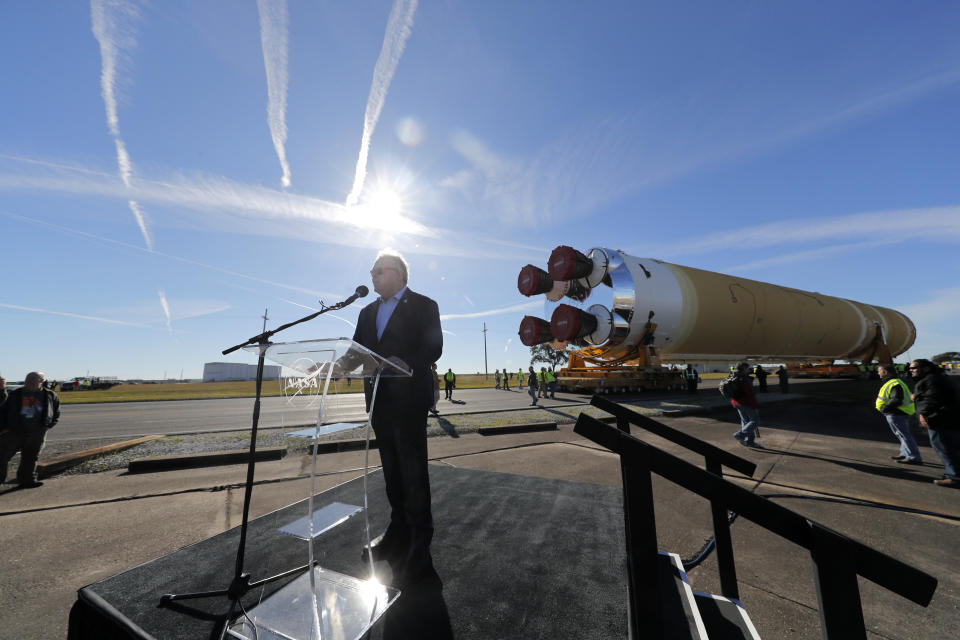 Jim Chilton, senior vice president of Boeing Defense Space & Security's Space and Launch division, speaks to workers and contractors as the core stage of NASA's Space Launch System rocket, that will be used for the Artemis 1 Mission, is moved to the Pegasus barge, at the NASA Michoud Assembly Facility where it was built, in New Orleans, Wednesday, Jan. 8, 2020. It will be transported to NASA's Stennis Space Center in Mississippi for its green run test. (AP Photo/Gerald Herbert)