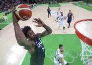 2016 Rio Olympics - Basketball - Final - Men's Gold Medal Game Serbia v USA - Carioca Arena 1 - Rio de Janeiro, Brazil - 21/8/2016. Deandre Jordan (USA) of the USA dunks as Nemanja Nedovic (SRB) of Serbia watches. REUTERS/Elsa/Pool