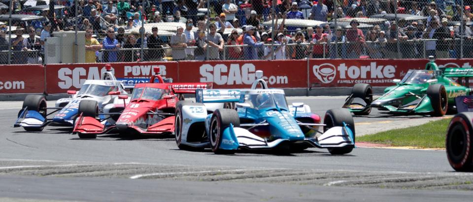 Josef Newgarden (2) accelerates his IndyCar out of turn 5 during the Sonsio Grand Prix, Sunday, June 12, 2022, at Road America near Elkhart Lake, Wis.