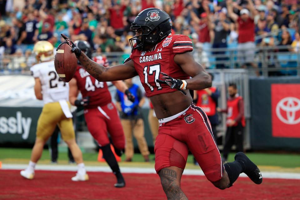 South Carolina Gamecocks wide receiver Xavier Legette (17) scores a touchdown during the first quarter of the TaxSlayer Gator Bowl of an NCAA college football game Friday, Dec. 30, 2022 at TIAA Bank Field in Jacksonville. The Notre Dame Fighting Irish held off the South Carolina Gamecocks 45-38. [Corey Perrine/Florida Times-Union]