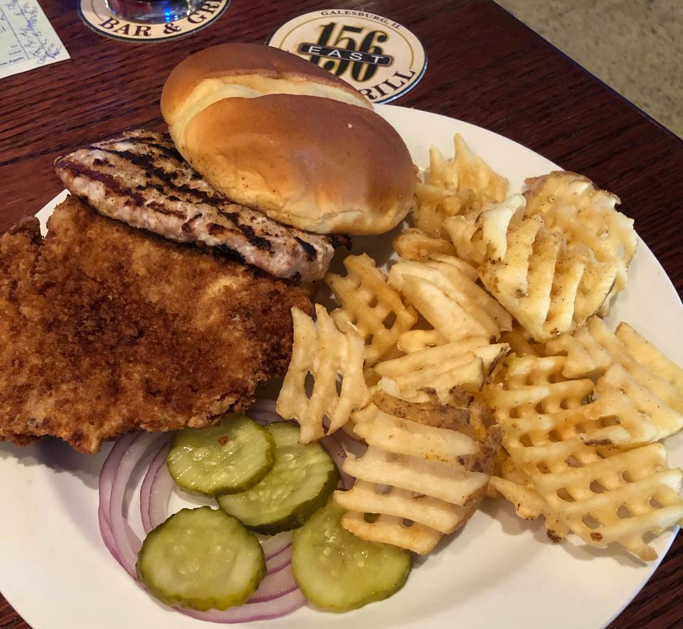 A grilled tenderloin, breaded tenderloin and waffle fries from 156 East in Galesburg.