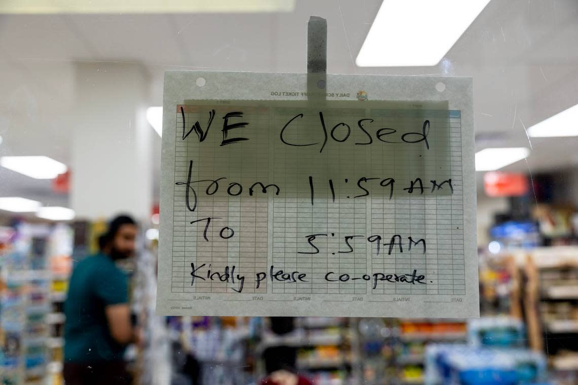 A store hangs a sign explaining its closure due to curfew during Spring Break 2024 in Miami Beach, Florida, on Friday, March 15, 2024.