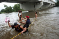 Honduran migrants, part of a caravan trying to reach the U.S., cross the Suchiate river with the help of fellow migrants to avoid the border checkpoint in Ciudad Hidalgo, Mexico, October 19, 2018. REUTERS/Edgard Garrido