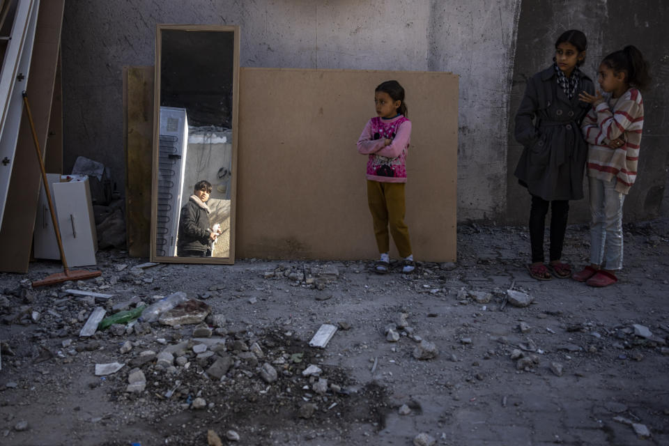 Palestinians check destruction after an Israeli strike in Rafah, Gaza Strip, Wednesday, Feb. 21, 2024. (AP Photo/Fatima Shbair)