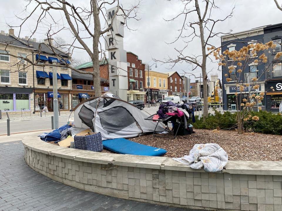 A tent has been set up in a raised garden bed in front of city hall in Guelph by an individual who is living inside it. Mayor Cam Guthrie says more needs to be done to address homelessness in the city, but a recent court ruling in Kingston, Ont., means he's pushing pause on plans to bring forward a motion to look at creating a temporary encampment.