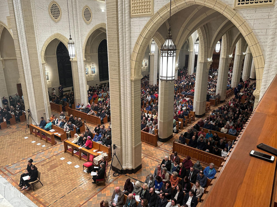 Mourners gather in the Basilica of Saints Peter and Paul in Lewiston, Maine, on Sunday evening for a vigil for mass shooting victims. (Emma Barnett / NBC News)