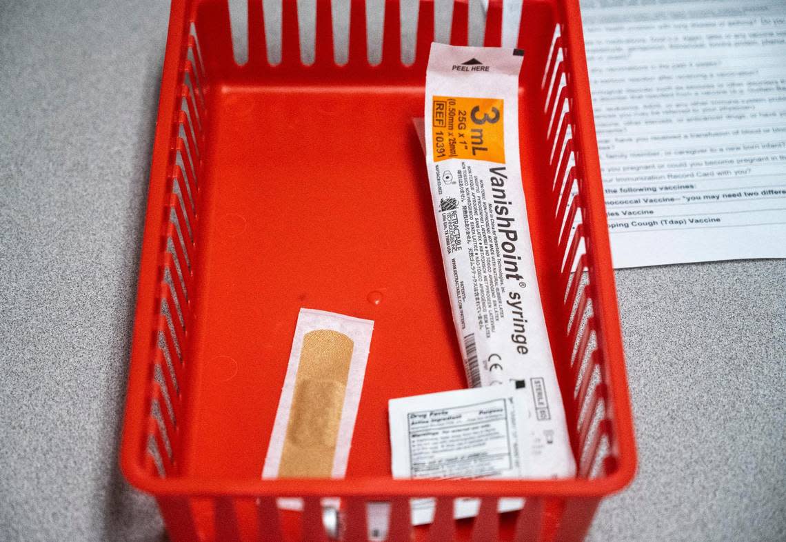 A dose of the Pfizer vaccine sits on a table before it is administered to Makenzie Porter, 11, at Bartell Drugs in University Place, on Thursday, July 14, 2022.