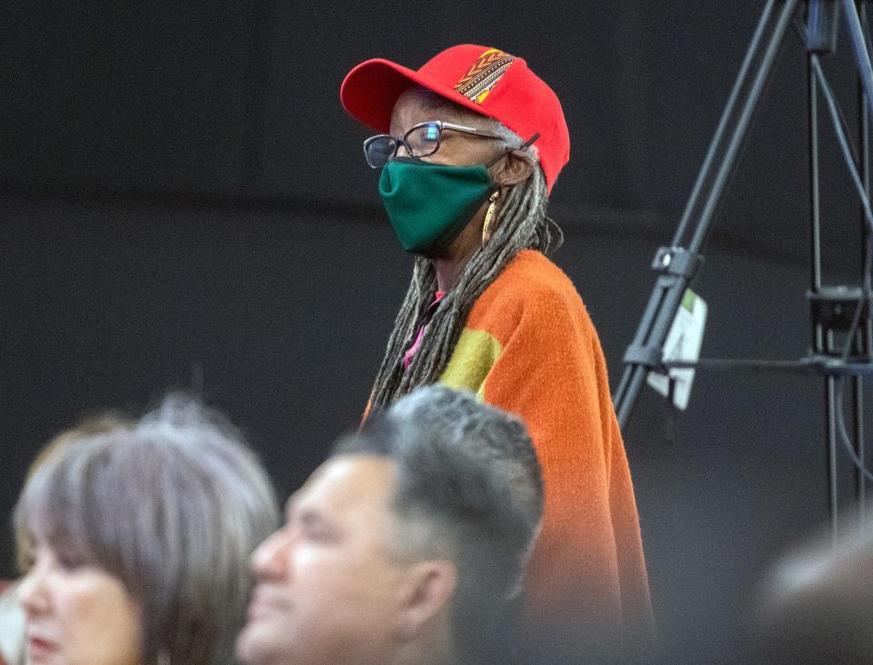 Cynthia Boyd stands while Stockton Mayor speaks during a public safety town hall meeting at Victory in Praise Church in Stockton on Wednesday, Oct. 5, 2022.