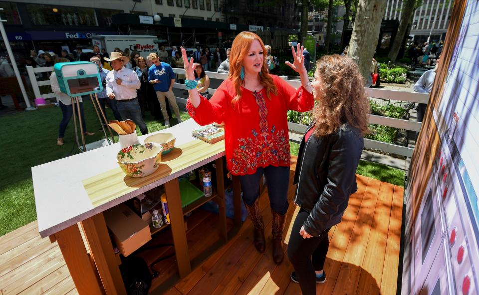 Ree Drummond, the Pioneer Woman, greets fans before playing with dogs from the North Shore Animal League that are up for adoption in Bryant Park in New York on Wednesday, May 15, 2019.