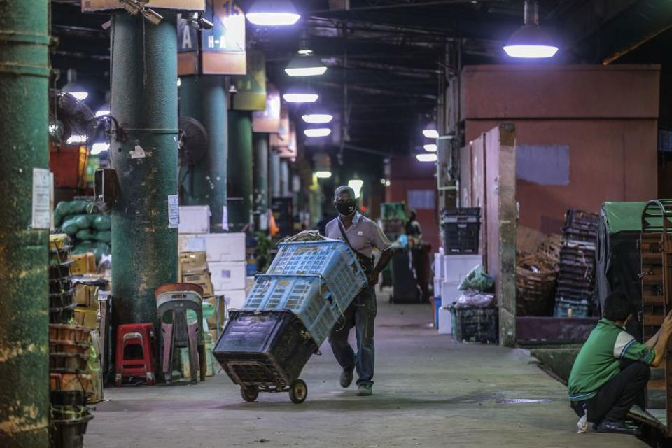 A general view of the Kuala Lumpur wholesale market as traders resume business after the enhanced movement control order on the area was lifted on May 13, 2020. — Picture by Hari Anggara