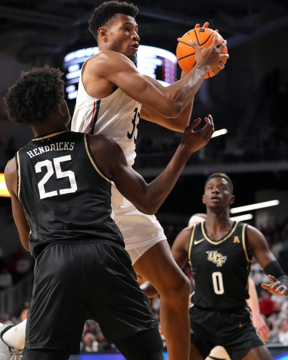 Forward Ody Oguama, here shown pulling in a rebound against UCF earlier this month, and the Bearcats are coming off a game in which they were outrebounded by ECU 46-27.