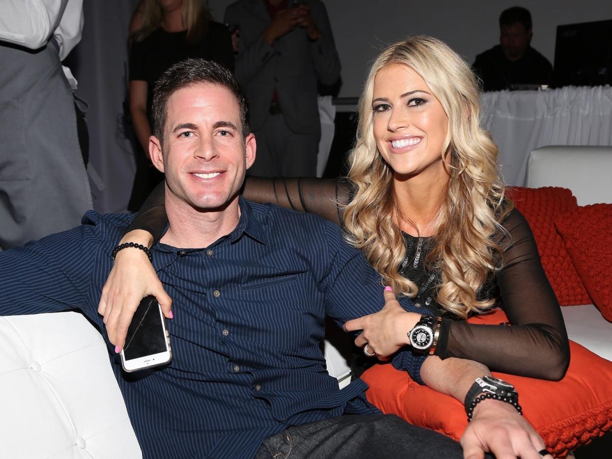 Tarek El Moussa and Christina Haack pose for a photo.