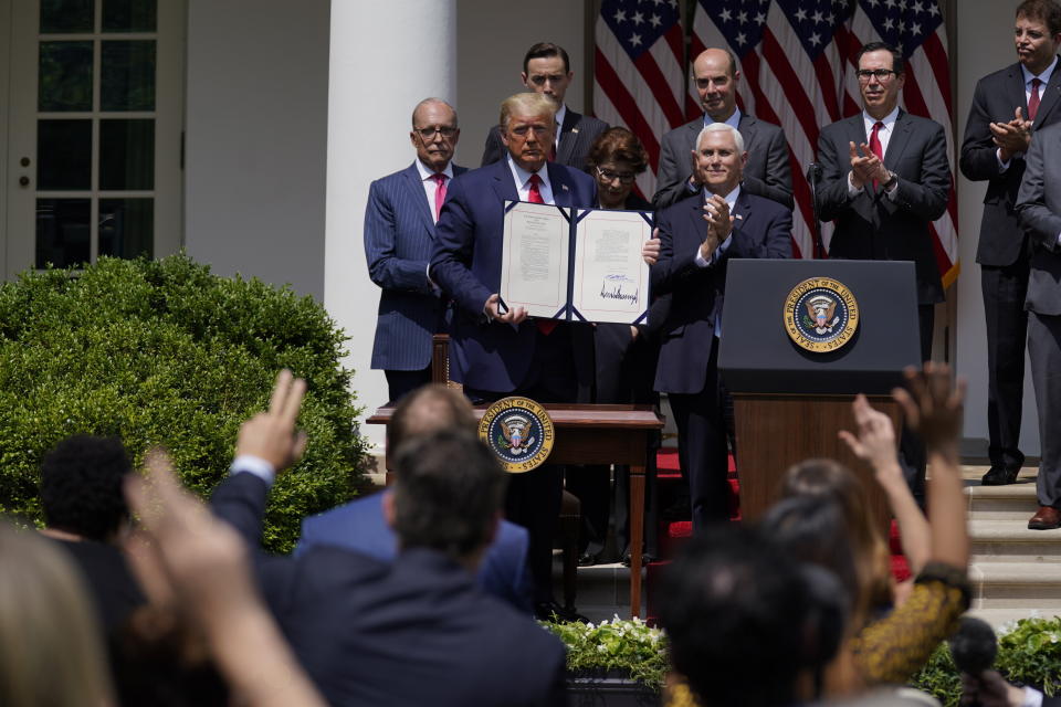 President Donald Trump poses for a photo after signing the Paycheck Protection Program Flexibility Act during a news conference in the Rose Garden of the White House on June 5, 2020. (Photo: AP Photo/Evan Vucci)