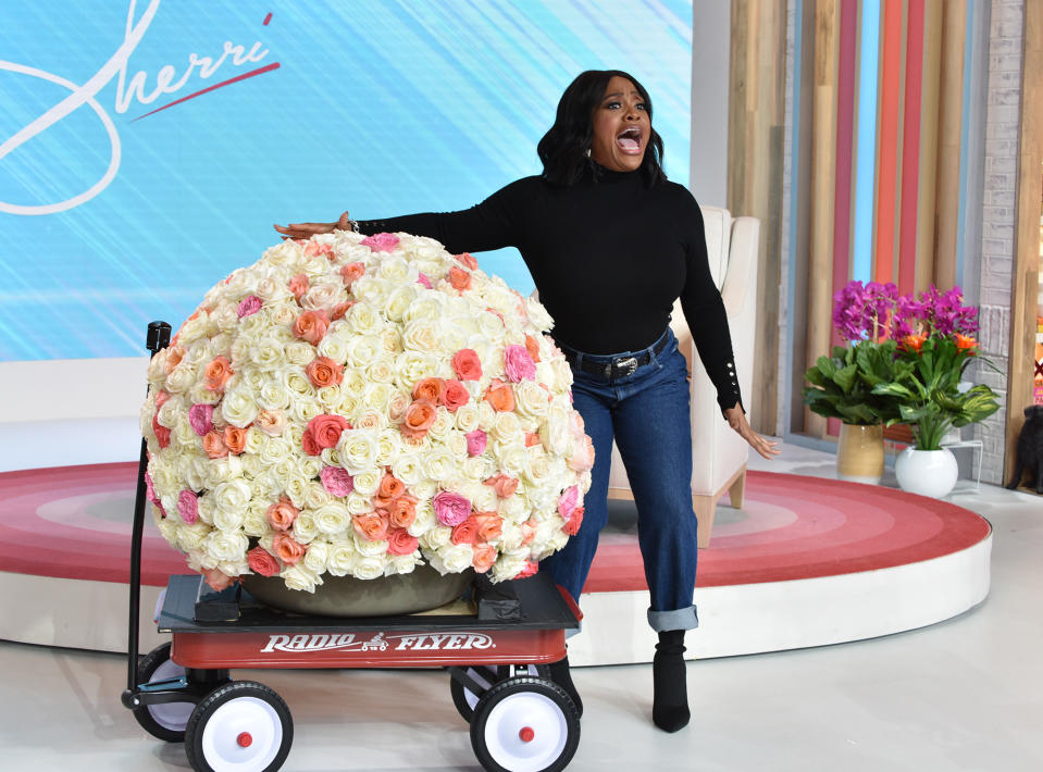 <p>Sherri Shepherd showcases a bouquet from Oprah Winfrey — and recreates the talk show host's iconic wagon moment — while taping her own talk show <em>Sherri </em>in N.Y.C. on Sept. 23. </p>