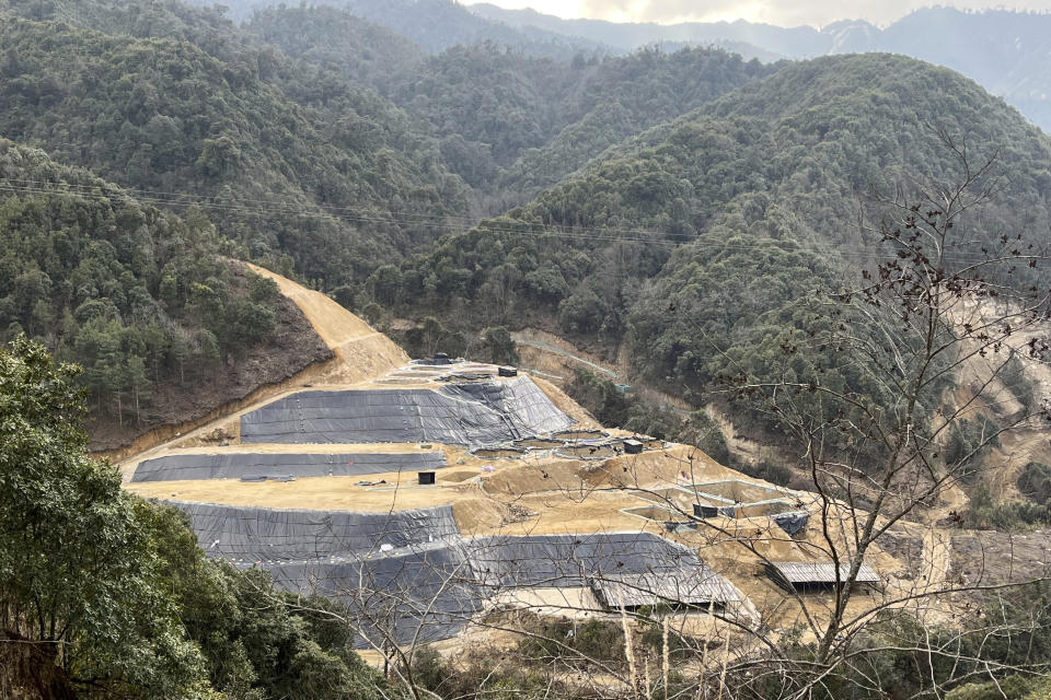 In this early 2022 photo provided by Global Witness, a new rare earth mine is dug into the side of a mountain in Pangwa, Kachin, Myanmar. The region is close to the Chinese border and the home of hundreds of rare earth mining sites. Bleaching agents used in extracting rare earth elements have tainted tributaries of Myanmar's main river, prompted landslides and poisoned the earth, according to witnesses, miners and local activists. (Global Witness via AP)