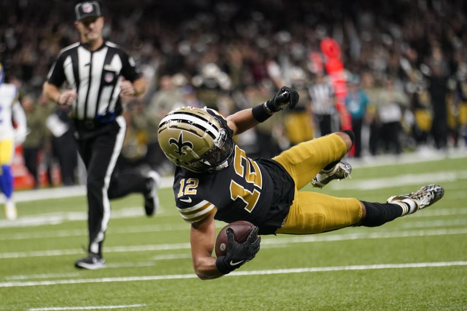 New Orleans Saints wide receiver Chris Olave scores a touchdown against the Los Angeles Rams in the second half of an NFL football game in New Orleans, Sunday, Nov. 20, 2022. (AP Photo/Gerald Herbert)
