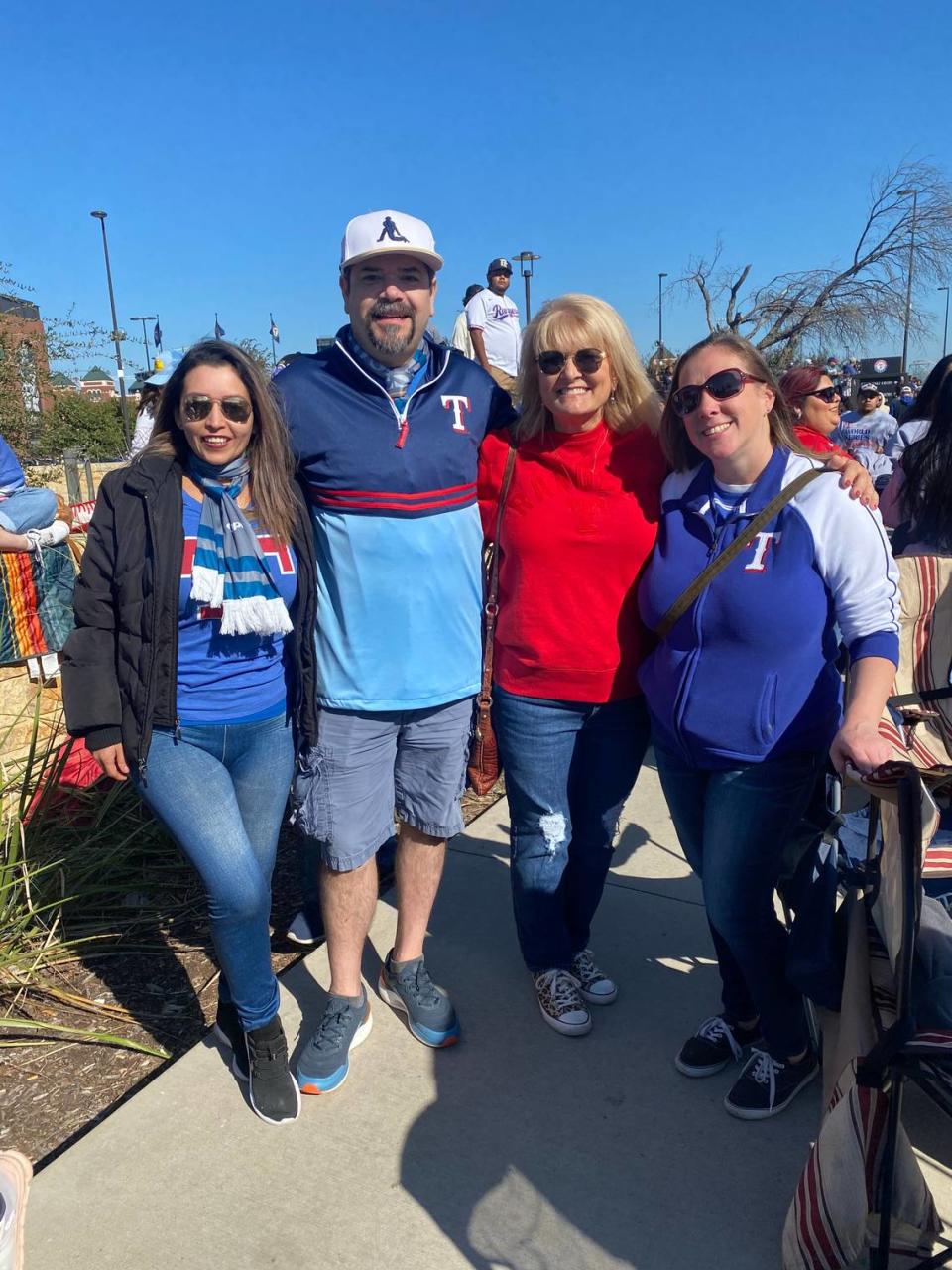 From left to right, Rangers fans Alex Saldivar, Ale Juarez, Kitty Wade and Mandy Cook are decked out in red and blue before the World Series victory parade.