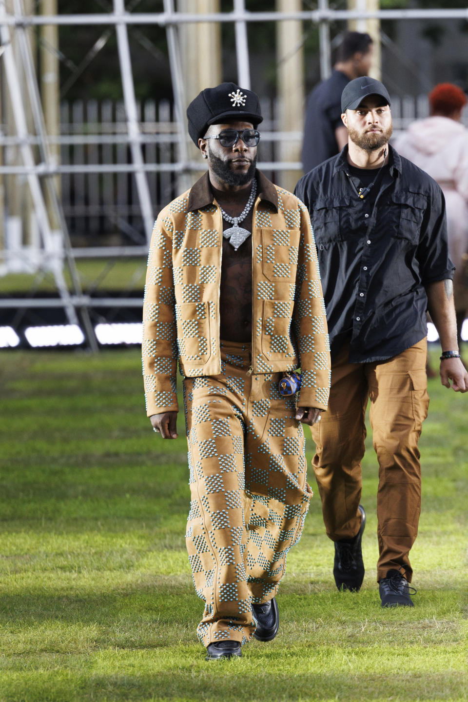 Burna Boy arrives for the Louis Vuitton Spring Summer 2025 collection, that was presented in Paris, France, Tuesday, June 18, 2024. (Photo by Vianney Le Caer/Invision/AP)