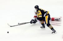 Oct 14, 2017; Pittsburgh, PA, USA; Florida Panthers defenseman Aaron Ekblad (5) knocks the puck away from Pittsburgh Penguins right wing Tom Kuhnhackl (34) during the second period at PPG PAINTS Arena. The Penguins won 4-3. Mandatory Credit: Charles LeClaire-USA TODAY Sports